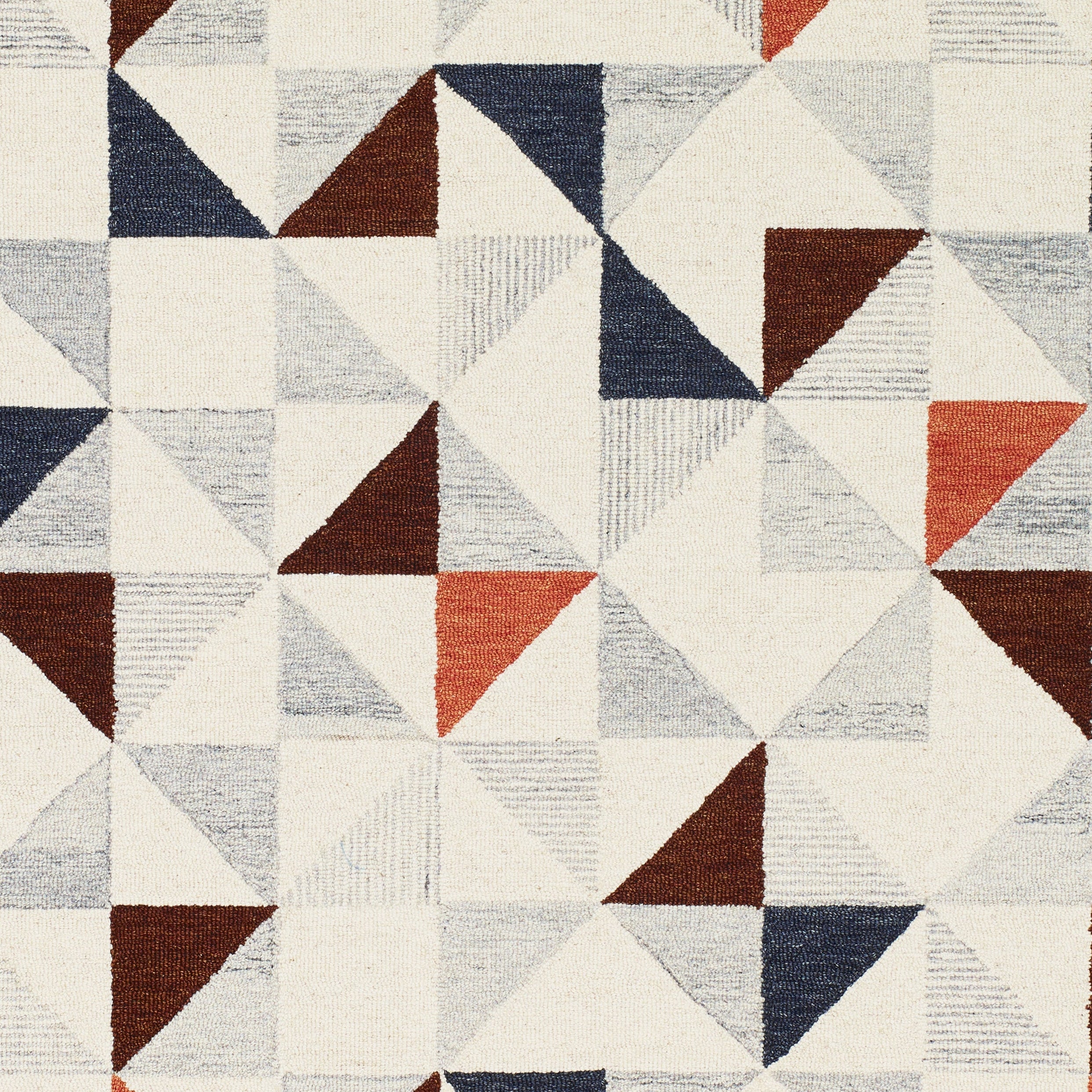 Texture close-up of multicolor geometric wool area rug triangle pattern